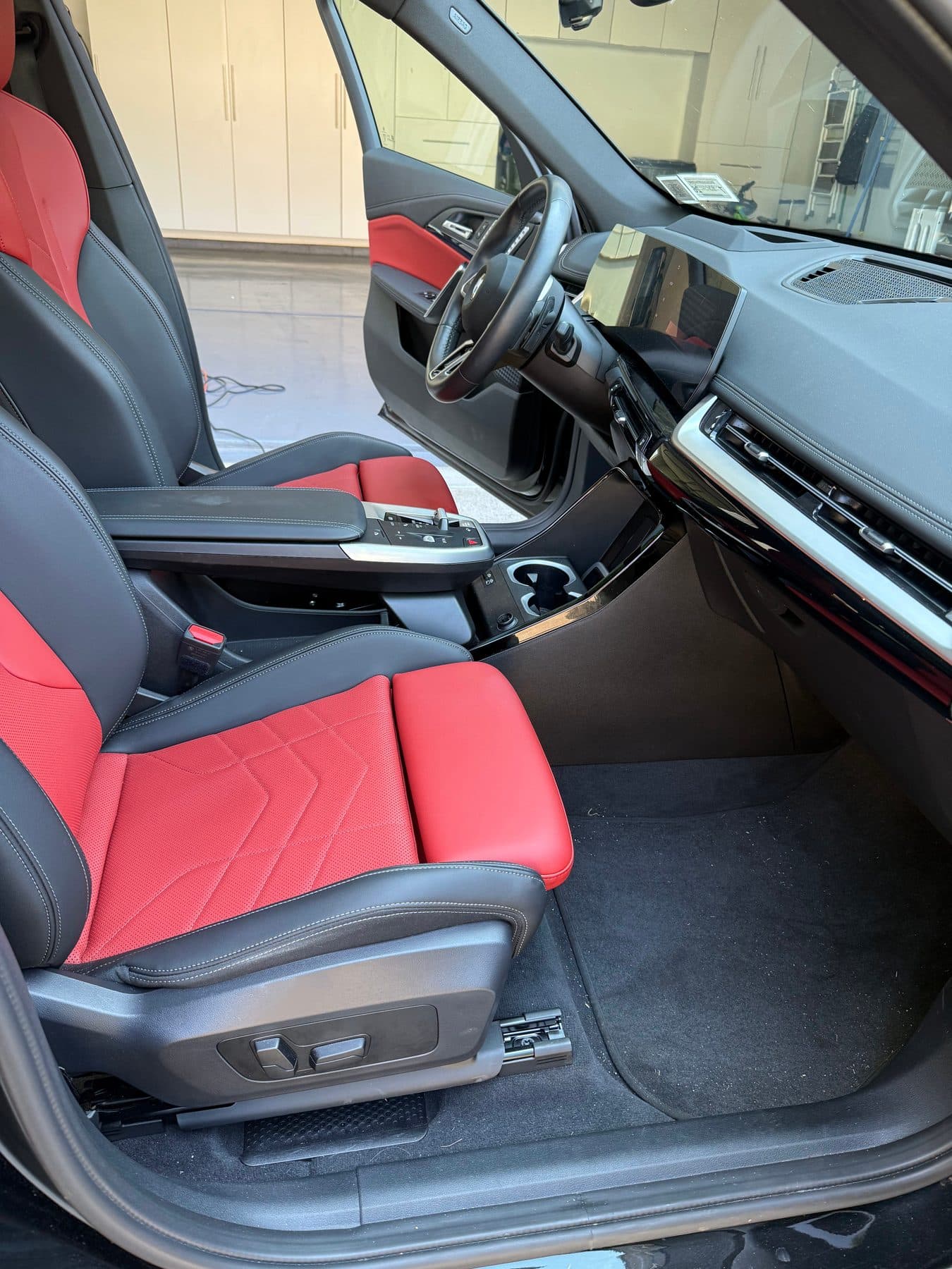 BMW X1 red and black interior after a full interior detail