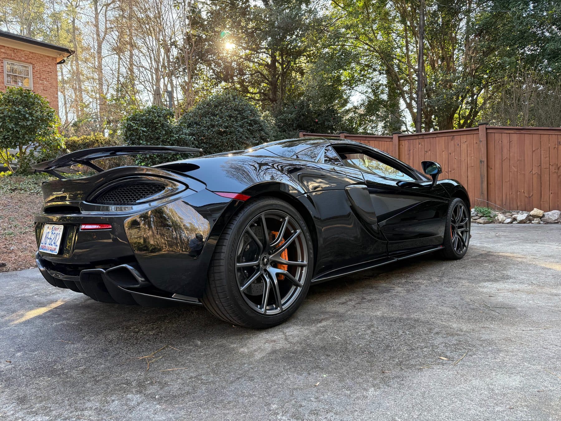 McLaren 570S Spider rear three-quarter after a full exterior detail