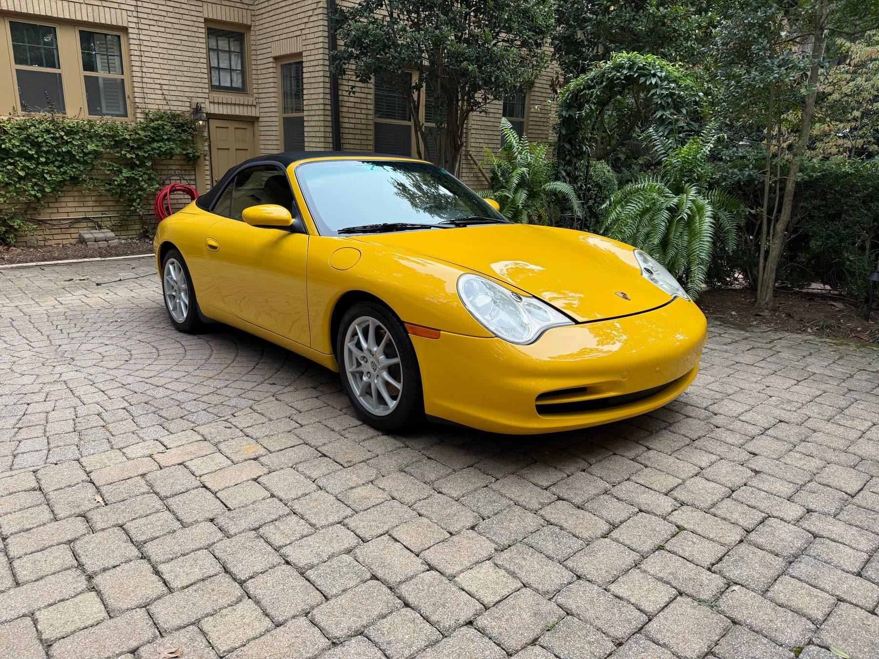 Yellow Porsche 911 Carrera cabriolet after a full detail