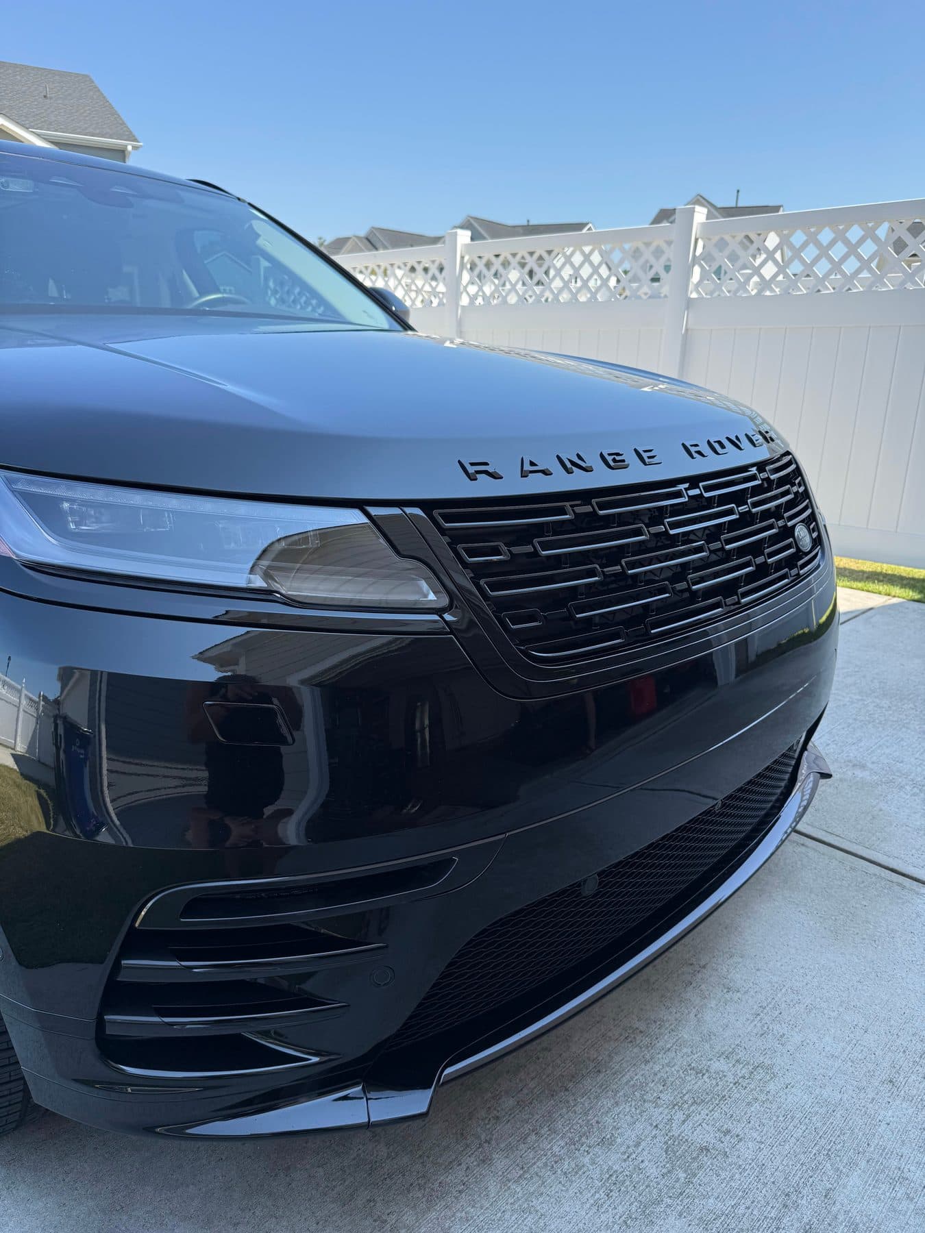 Blacked-out Range Rover Sport hood and grille after an exterior detail